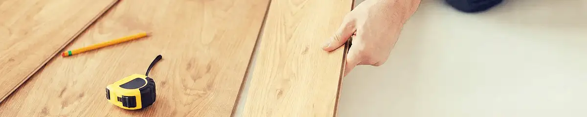 A professional installing wood flooring in Nashville, TN