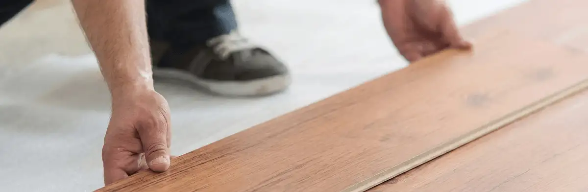 A professional installing laminate flooring in Nashville, TN