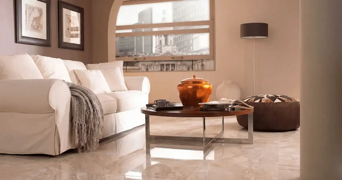 Modern living room with professionally installed marble flooring, a beige sofa, coffee table in Nashville, TN