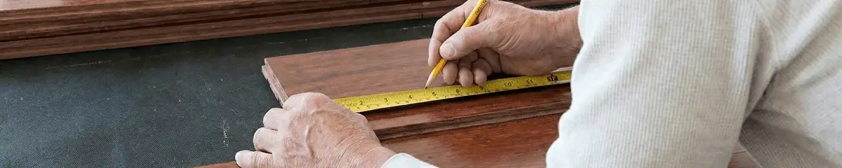 A professional installing wood flooring in Nashville, TN